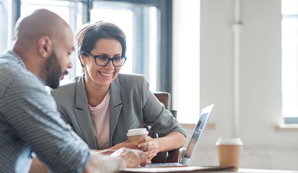 Man and woman working at computer