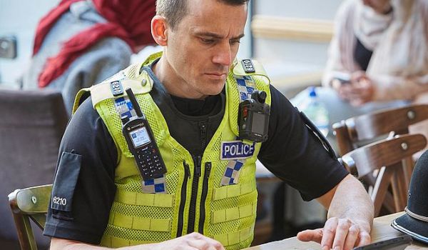 Police officer working on a tablet