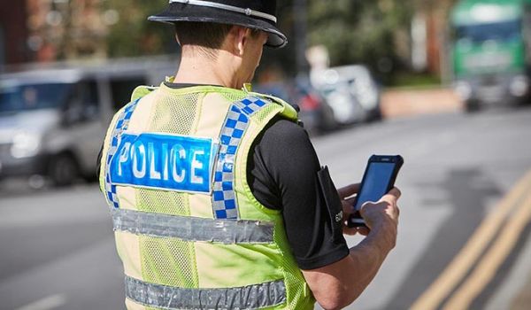 Police officer using mobile technology