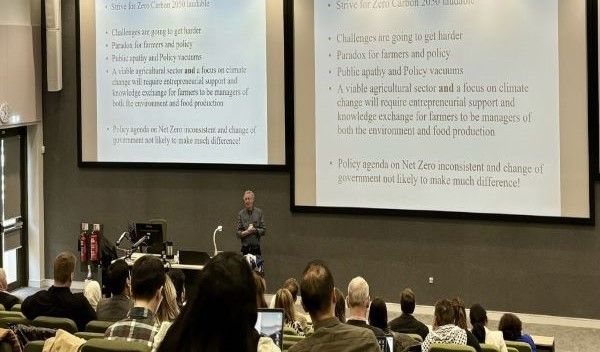 Professor Gerard McElwee delivering his presentation in front of an audience.