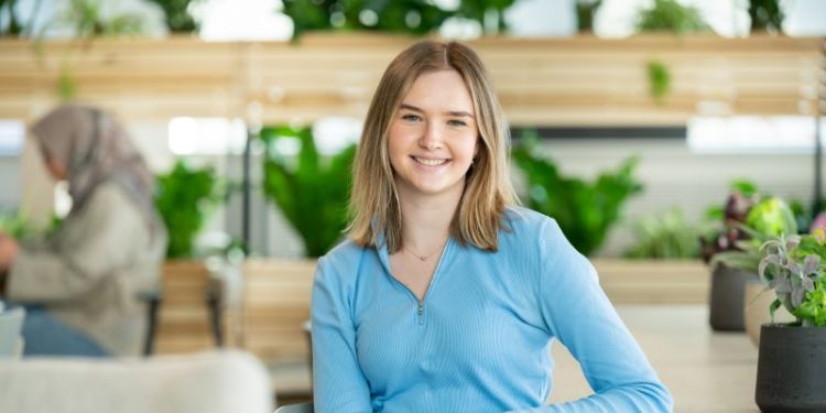 Undergraduate student sat in the Esther Simpson cafe.