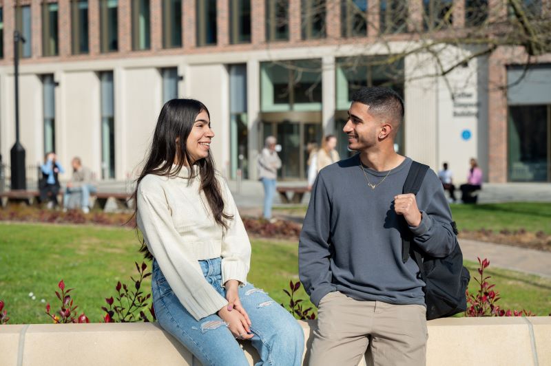 Students talking outside Esther Simpson