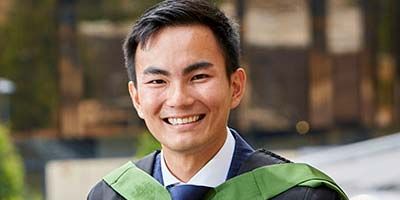 Damien Lee in his graduation gown