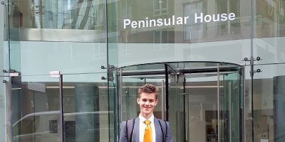 Photo of James Tucker standing outside Peninsular House