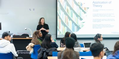 Kelly Hobson smiles whilst giving lecture