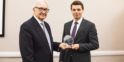 Photograph of Tim Knickmann being presented with the Enterprise Award