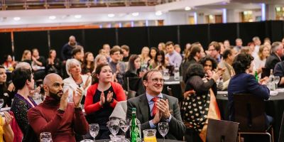 Business School staff and students applauding at the Partnerships Award