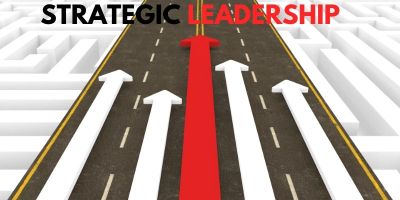 4 white arrows and one leading red arrow traveling down the same road.