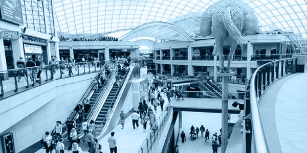 Inside a shopping centre, with a blue overlay on top