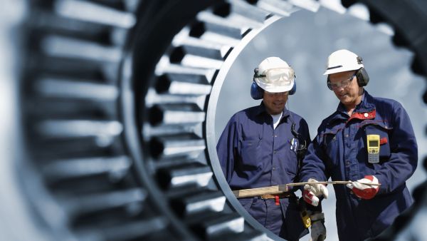 Engineers through cogwheel