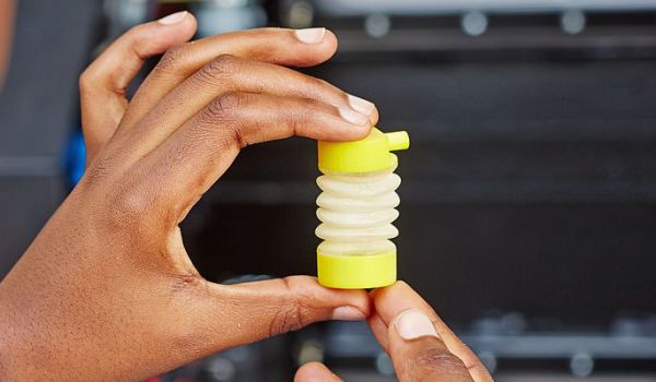 Hands holding a 3D printed object