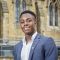 Jordan Hamilton standing outside Leeds University Business School