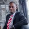 Tosin sitting in a corporate office