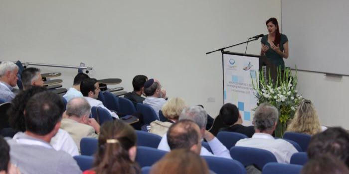 Photograph of Wändi Bruine de Bruin delivering a keynote lecture