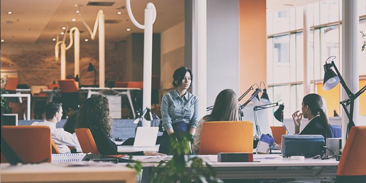 Women sat in informal meeting in modern office