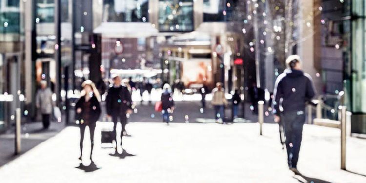 A blurry shot of a retail high street in the centre of Leeds