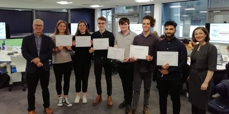 Photo of winning innovation team with certificates for Dragons Den panel event. 
